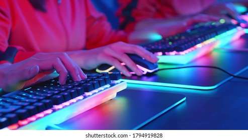 close up of cyber sport gamers team play game while clicking the mouse and keyboard - Shutterstock ID 1794919828