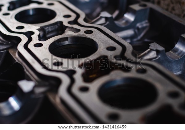Close up of the cylinder\
block petrol engine,Automotive part,machine part .Disassembled\
motor vehicle for repair. Parts in engine oil. Car engine repair in\
the service.