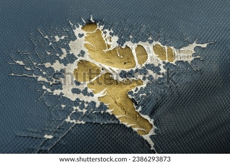 close up of damaged or torn motorcycle seat leather