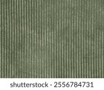 Close up of dark green fabric in fluted strips pattern. Seamless background texture.