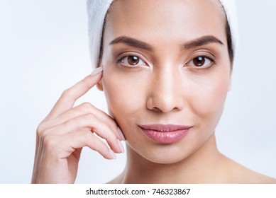 Close up of dark-eyed dark-haired woman in towel turban