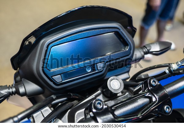 Close up\
dashboard of \
digital mileage\
motorcycle.