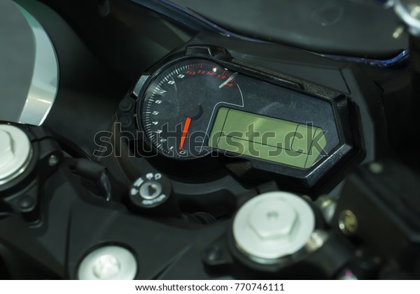 Close up\
dashboard of \
digital mileage\
motorcycle.