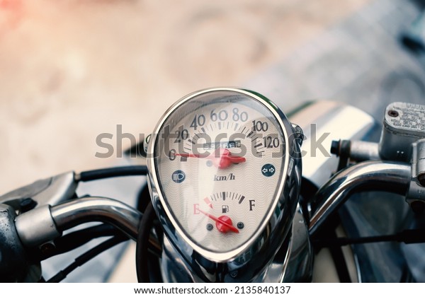 Close up dashboard of\
mileage motorcycle.