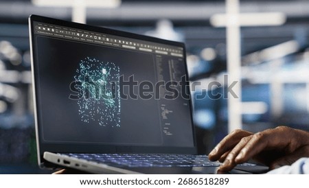 Close up of data center admin using machine learning algorithms on laptop to analyze large datasets. Server farm worker using artificial intelligence on notebook to recognize data patterns, camera B