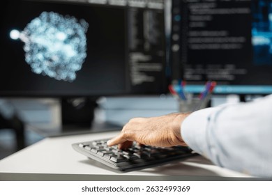 Close up of data center engineer using artificial intelligence visualization tools on PC to identify equipment malfunctions. Server room expert typing on keyboard, looking at AI generated insights