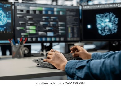 Close up of data center professional using machine learning algorithms to analyze large datasets. Server farm engineer typing on keyboard, using artificial intelligence to recognize data patterns