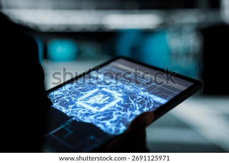 Close up of data center programmer using AI neural networks on tablet to troubleshoot backend operations. Server hub worker runs machine learning software development tools, resolving system crashes