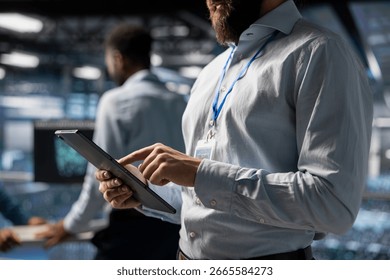 Close up of data center technician does AI deep learning automatization for infrastructure, working on elevated industrial platform. Engineer maintaining server rigs using artificial intelligence. - Powered by Shutterstock - Get 15% off with code: PIKWIZARD15