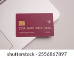 Close up of debit and credit cards placed in front of laptop. online shopping payment and retail concept. mockups and fake credit cards. Color credit card.