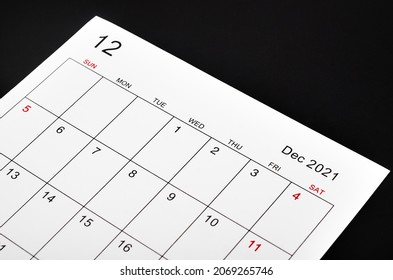 Close up December 2021 calendar sheet on black background. - Shutterstock ID 2069265746