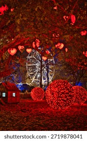 Close Up of Deciduous Tree Decorated with Red Heart Shaped Christmas Lights in Vienna
