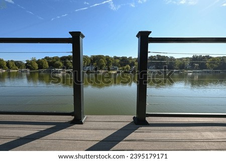 close up of deck on the lake with steel cable railing 