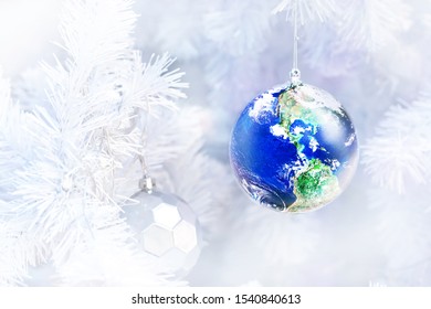 close up decorated Earth ornament on white christmas tree with blurred background, Gift earth a great christmas concept, Elements of this image furnished by NASA