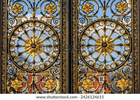 Close up of the decorations on the Golden Gates, historical ornate Victorian gateway from 1862 located in front of the Town Hall in Warrington, Cheshire, England, UK