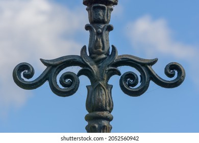 Close up of decorative lamppost, iron work, architecture detail, shallow depth of field, autumn season 2021