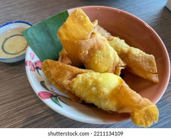 Close Up Deep Fried Wonton (plain Eggroll Wrappers) With Plum Sauce