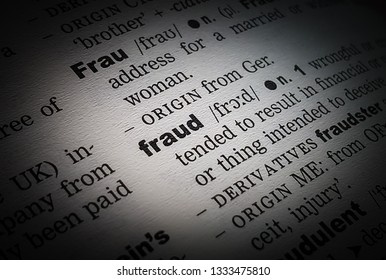 A Close Up Of The Definition Of The Word: Fraud, In An English Dictionary.