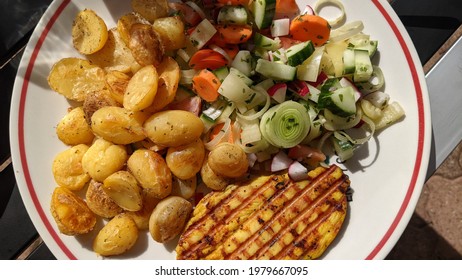 Close Up Of A Delicious Meal On A White Plate With Grilled Potatoes And Chicken Breast Garnished With Mixed Salad. Healthy Summer Meal, Grilled Dinner Following The Zone Diet.