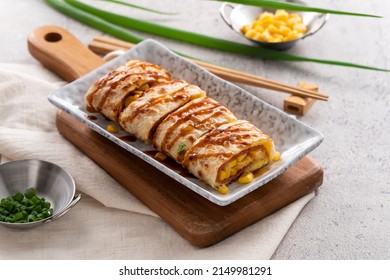 Close Up Of Delicious Taiwanese Omelette, Egg Pancake Roll With Ham And Corn Kernels, Famous Breakfast In Taiwan.