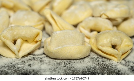 Close Up To Delicious Tortellini A Ring-shaped Pasta From Italy. Traditionally They Are Stuffed With A Mix Of Meat, Parmigiano Reggiano Cheese, Egg And Nutmeg