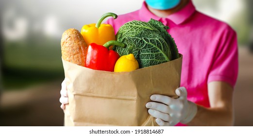 Close up of delivery fresh vegetables in paper bag. Express food delivery, online shopping concept. Home delivery food during virus outbreak.