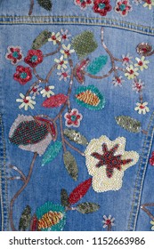 Close Up Denim Embroidered Flowers Jacket Jeans Texture.
