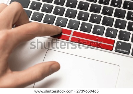 Close up of Denmark flag on computer keyboard