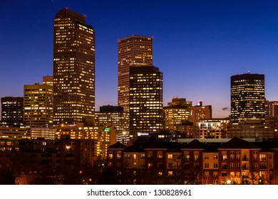Close up of Denver Colorado skyline at dusk during the blue hour with lighted buildings