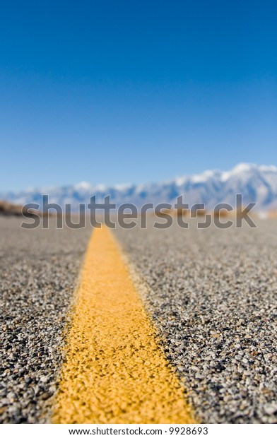 Close up of a desert\
highway lane marker