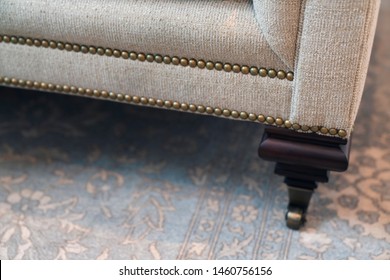 close up design part of sofa detail arm rest leg and upholsty fabric trim finishing furniture deisgn ideas concept