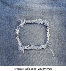 Close Up Of Destroyed Torn Denim Blue Jeans Patch 