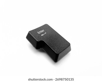 Close up of a detached computer keyboard Enter key placed on a pure white background. Minimalist, high resolution macro shot ideal for tech tutorials, UI UX design, software ads, or keyboard repair