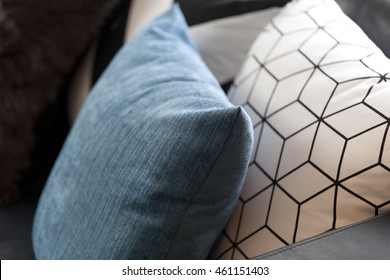 Close Up Detail Of Blue Pillow On Sofa In A Home.