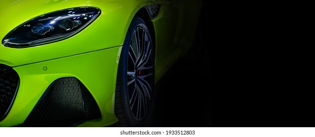 Close Up Detail Green Modern Car Headlights With Led Technology On Black Background Free Space On Right Side For Text.