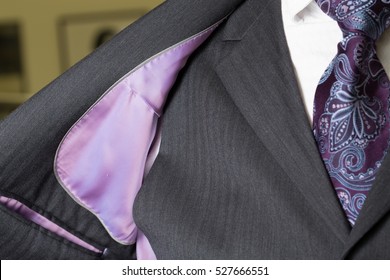 Close Up Detail Image Of Bespoke Tailored Grey Business Suit With Purple Tie, Waistcoat And Shirt