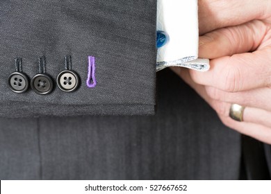 Close Up Detail Image Of Bespoke Tailored Grey Business Suit Sleeve Buttons And Cuff