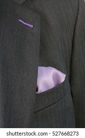 Close Up Detail Image Of Bespoke Tailored Grey Business Suit With Purple Handkerchief