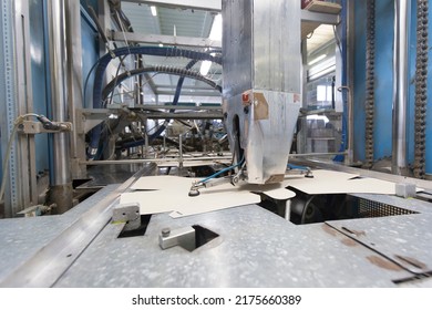 Close Up Detail Of Industrial Machinery At Work In A Production Line, Conveyor Belts Are Visible, No People Are Present.