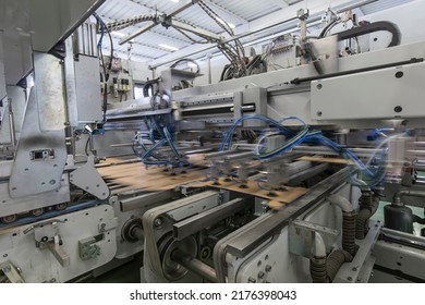 Close Up Detail Of Industrial Machinery At Work In A Production Line, Conveyor Belts Are Visible, No People Are Present.