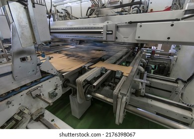 Close Up Detail Of Industrial Machinery At Work In A Production Line, Conveyor Belts Are Visible, No People Are Present.