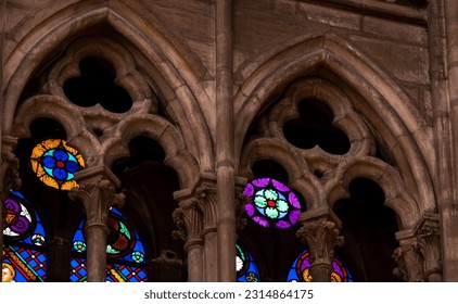 Close up detail of inside St. Denis Basilica in Paris, France showing stained glass windows, gothic stone tracery in vaulted ceiling.  - Powered by Shutterstock