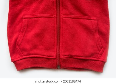 Close Detail Of Kids Red Hoodie Sweatshirt With Zip Fastener And Pocket On White Background.