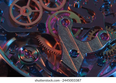 Close up detail of a macro clockwork inside a shiny iron wristwatch with sapphire rear glass bottom.