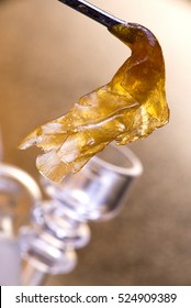 Close Up Detail Of Marijuana Oil Concentrate Aka Shatter Dab With Glass Rig 