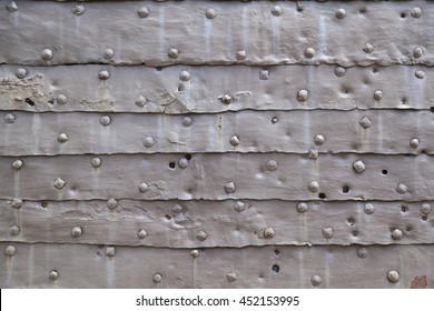 Close Up Detail Of Medieval Castle Door Texture With Metal Armor Plates