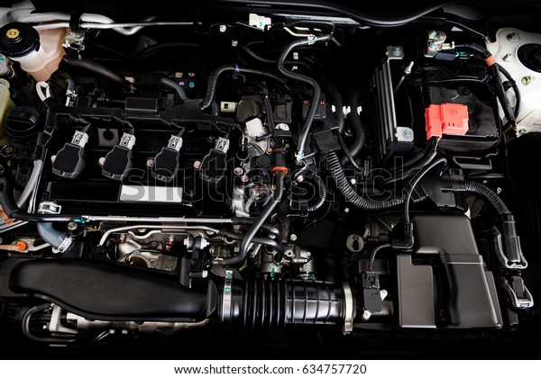 Close up detail of new car engine The\
powerful engine of a car. Internal design of\
engine