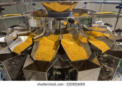 Close up detail on food packaging industrial machinery at work. - Powered by Shutterstock