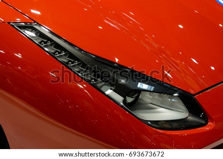 Close up detail on one of the LED headlights super car