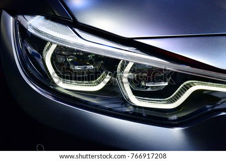 Close up detail on one of the LED headlights modern car.